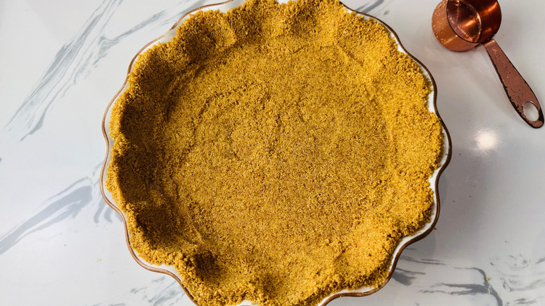 Graham cracker crust pressed into pie dish