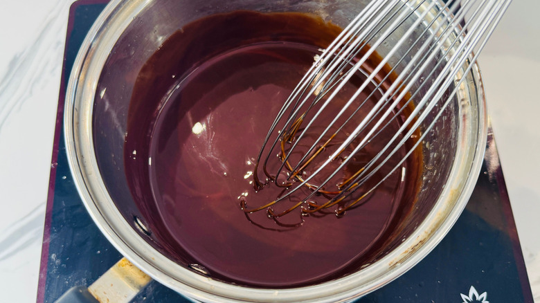 Melted chocolate and whisk in saucepan