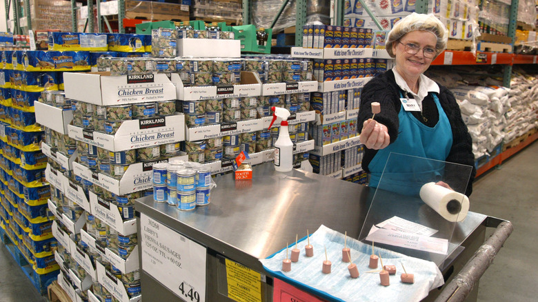 worker handing out costco sample 