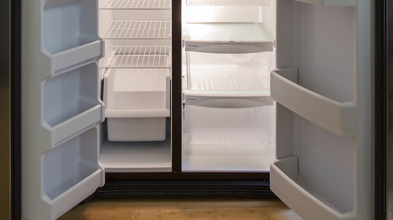 empty fridge with open doors