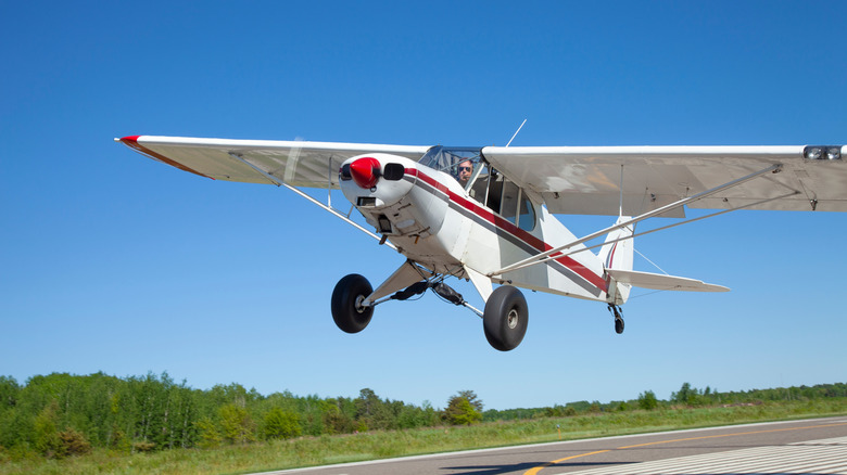 Small airplane taking off at a municipal airport
