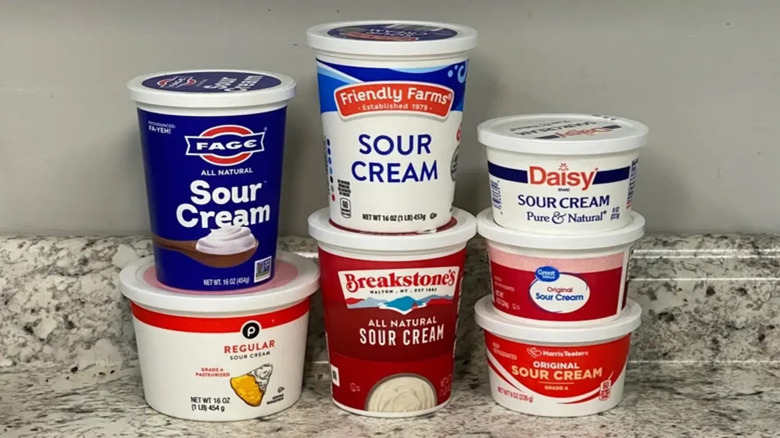 Sour cream in a bowl on a wooden table.
