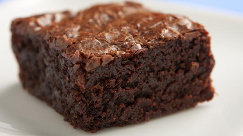 one brownie on a plate 