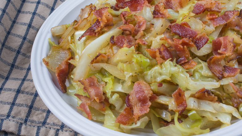 Southern fried cabbage on a white plate