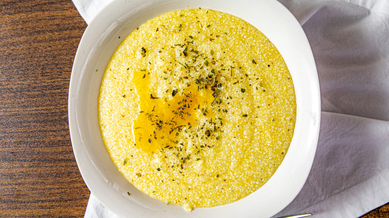 A bowl of prepared grits, seen from above.