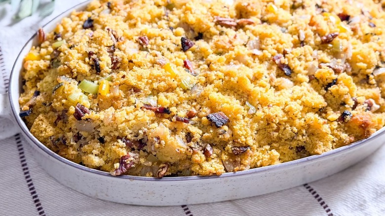 Southern-style homemade cornbread dressing in serving dish close up