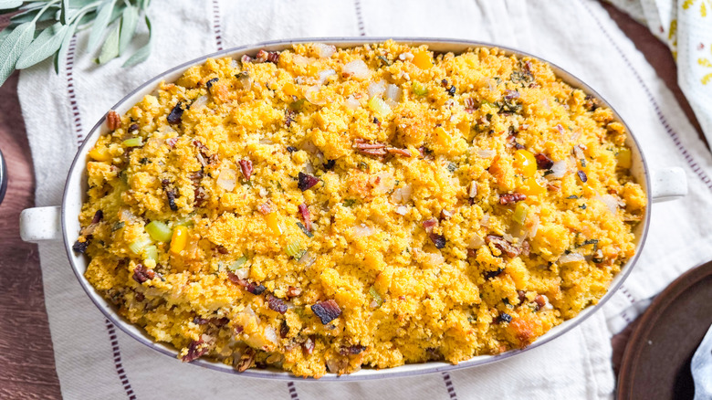 Southern-style homemade cornbread dressing in serving dish on table
