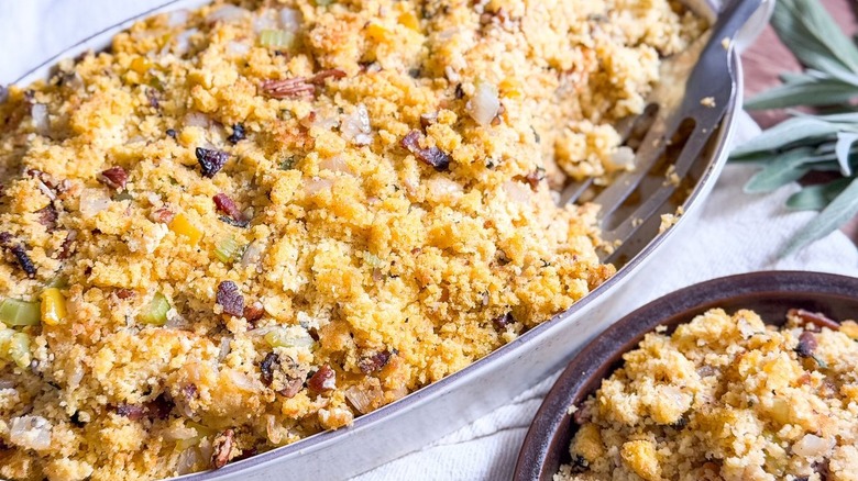 Southern-style homemade cornbread dressing in serving dish and on plate