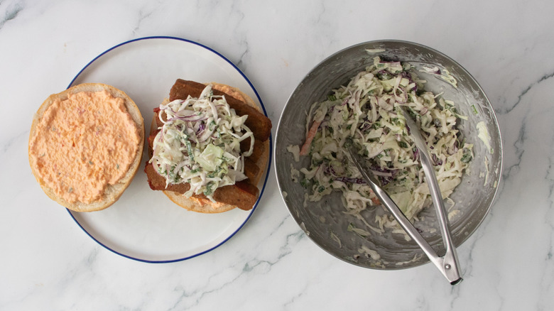 Open-faced meatloaf sandwich with pimento cheese and coleslaw