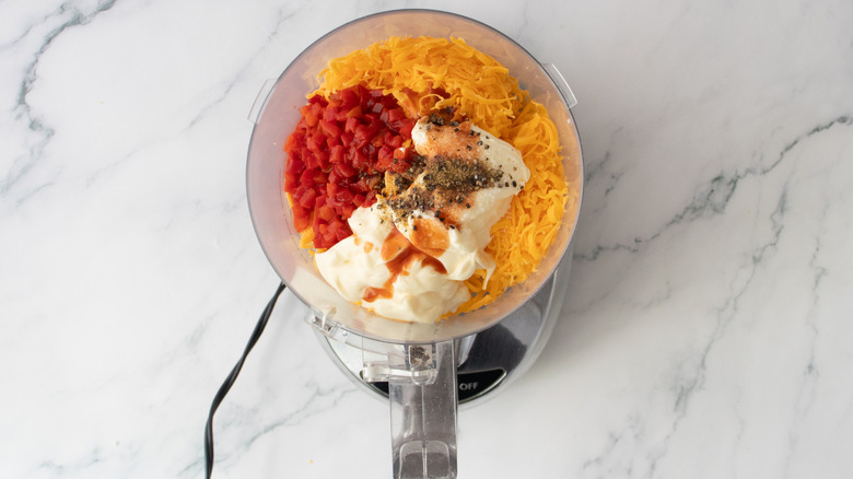 Pimento cheese ingredients in a food processor