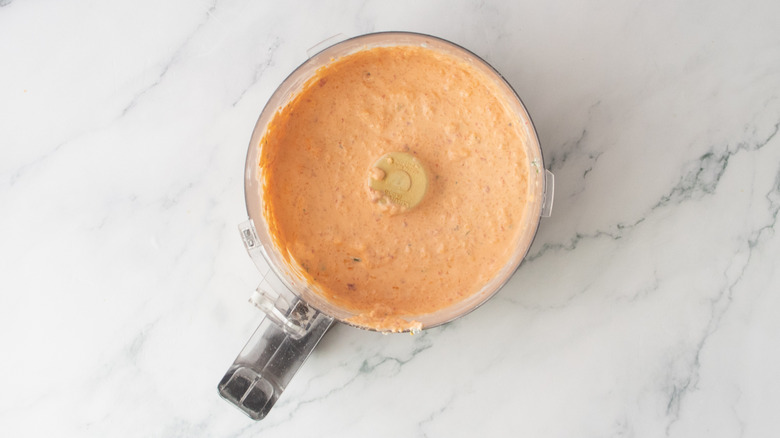 Blended pimento cheese spread in a food processor