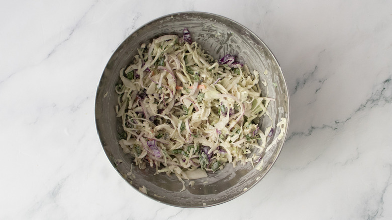 Composed cole slaw in a medium metal bowl