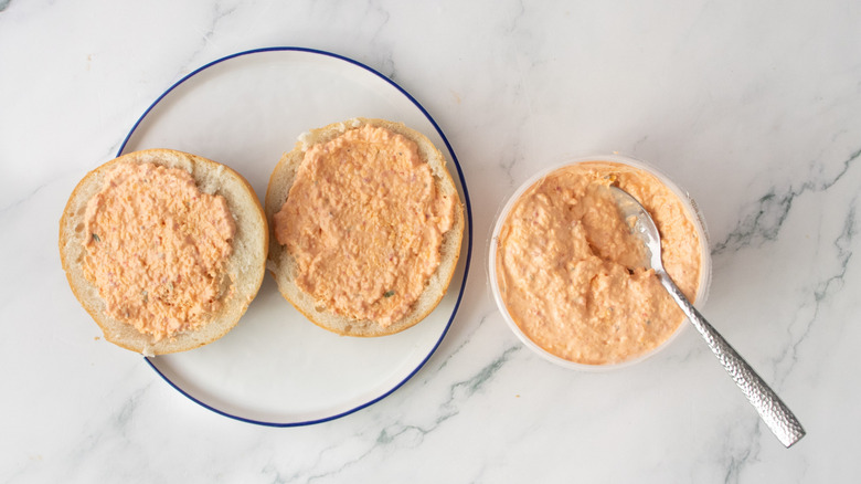 Split sandwich rolls topped with pimento cheese