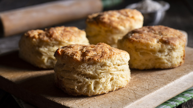 Golden biscuits on a cutting board.