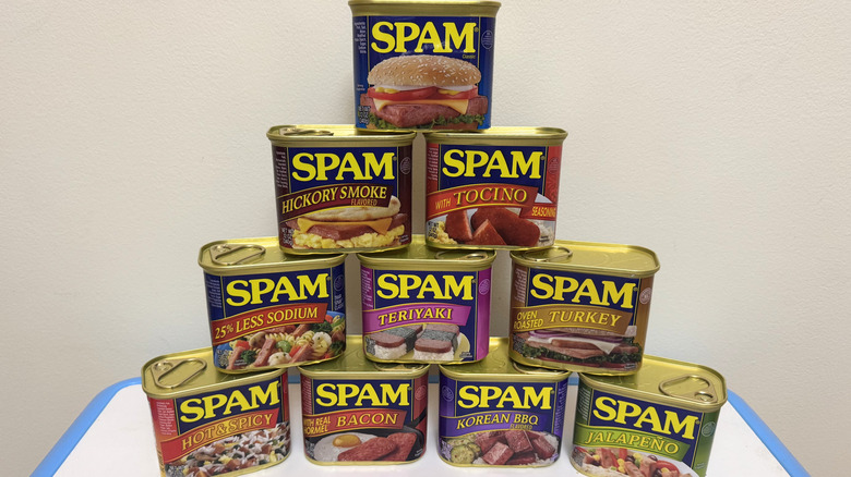 variety of canned Spam flavors arranged in pyramid