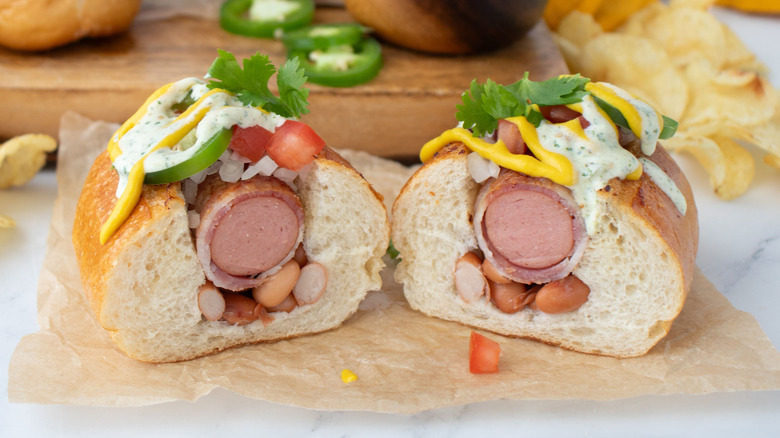 Sonoran hot dog cut in half