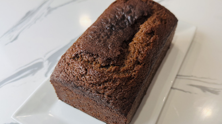 Spiced gingerbread loaf on platter