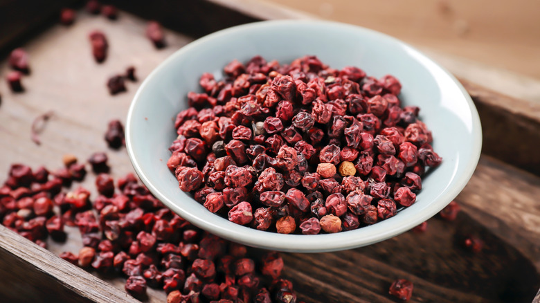 An overflowing bowl of Sichuan peppercorns
