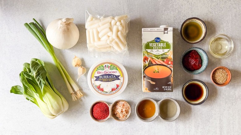 Spicy baked tteokbokki ingredients on countertop