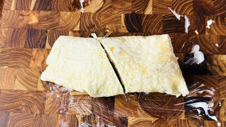 Wrap cut in half on cutting board