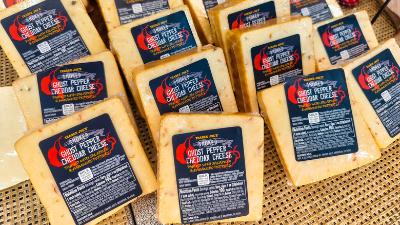 Packages of smoked ghost pepper cheddar cheese on display at Trader Joe's