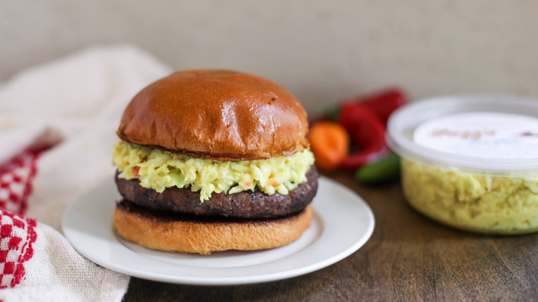 A burger topped with hot slaw