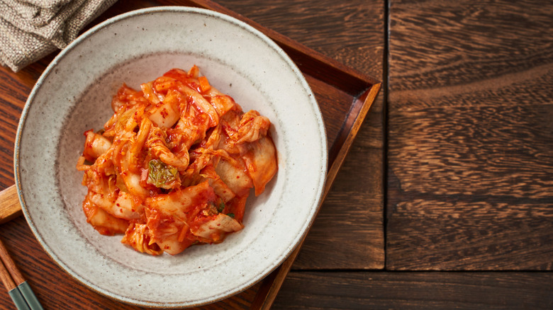 A bowl of spicy kimchi on a table