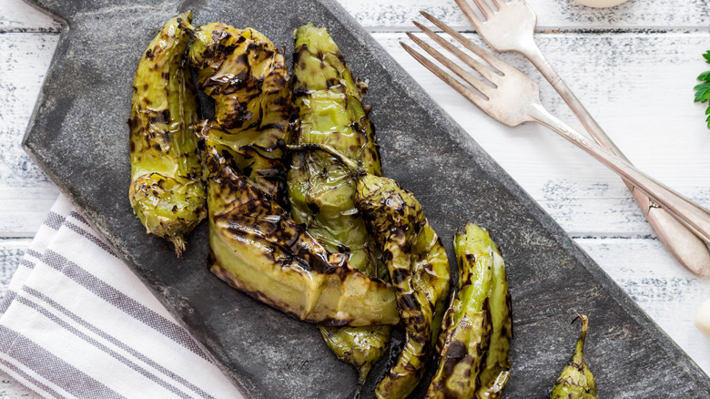 Roasted hatch chiles on a cutting board
