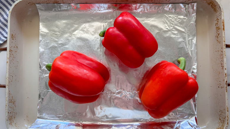 3 peppers on baking sheet