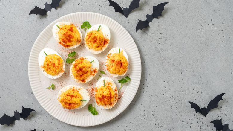 Olive spiders and deviled eggs