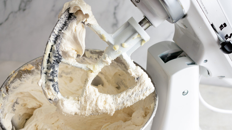 Frosting mixed in a bowl with a stand mixer using the paddle attachment