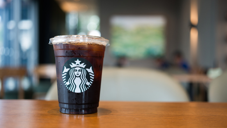 An iced Americano on a table at Starbucks