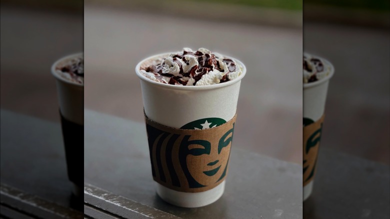 A hot chocolate at Starbucks with its lid off