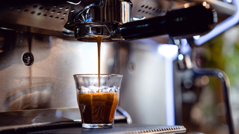 Espresso machine brewing a shot of espresso