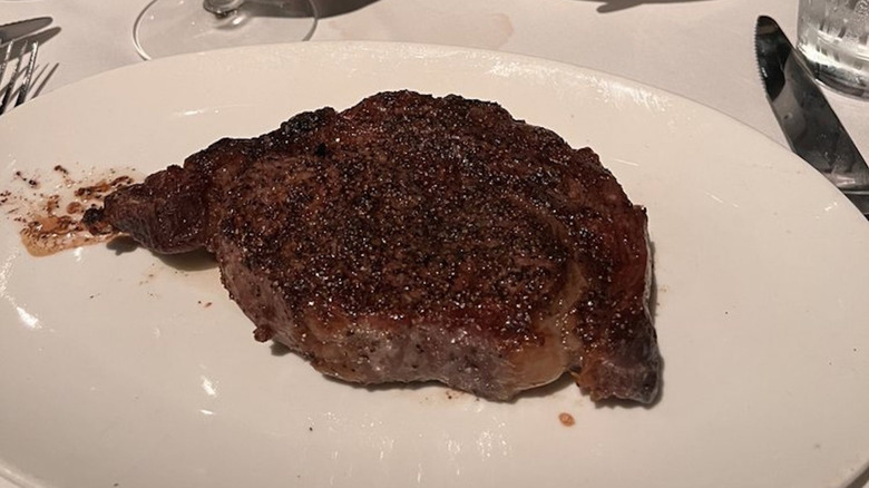 Del Frisco's Double Eagle Steakhouse ribeye served on a white plate