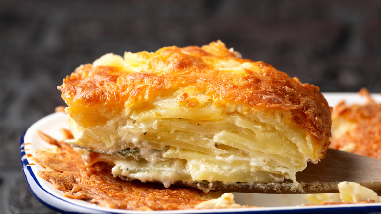 A slice of au gratin potatoes on a plate