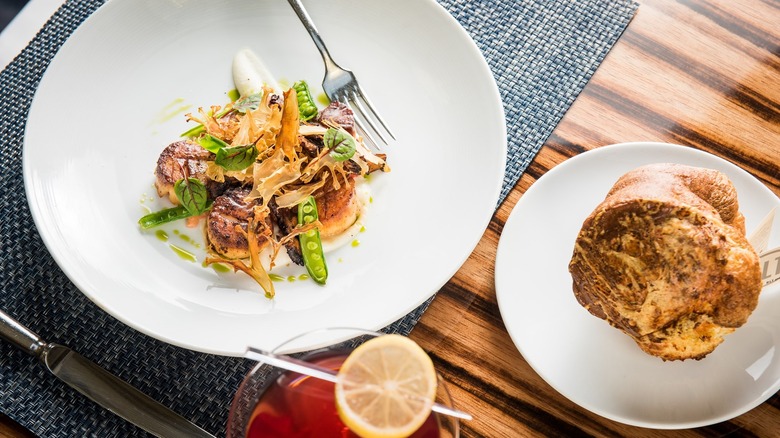 Steak with peas and a cocktail from BLT Restaurants