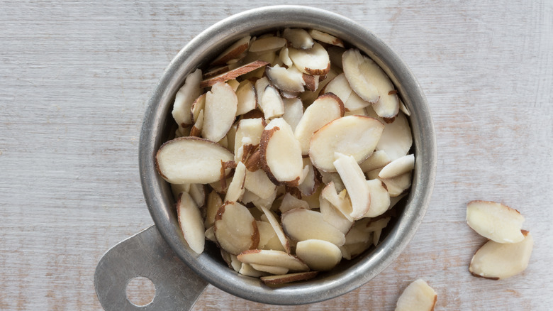 measuring cup of slivered almonds