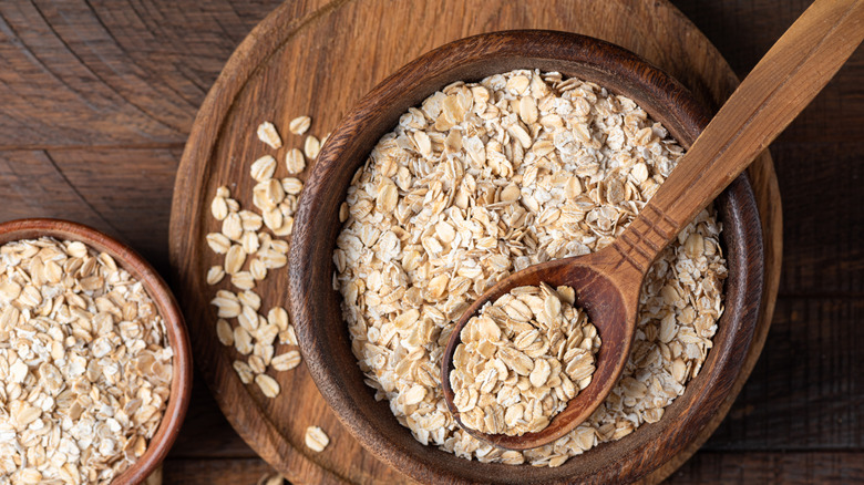 dry rolled oats in a wooden bowl