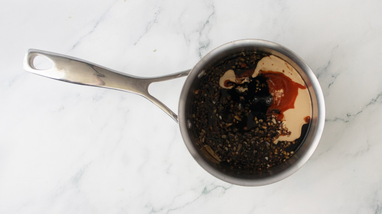 A small saucepan filled with glaze ingredients