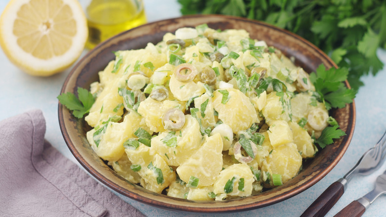 a bowl is filled with potato salad