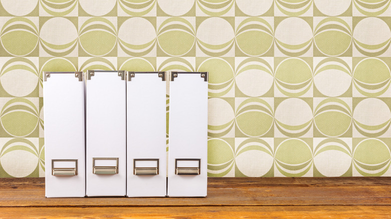 white magazine holders on a wooden table