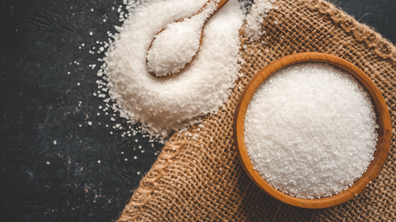 Wooden bowl and spoon of salt
