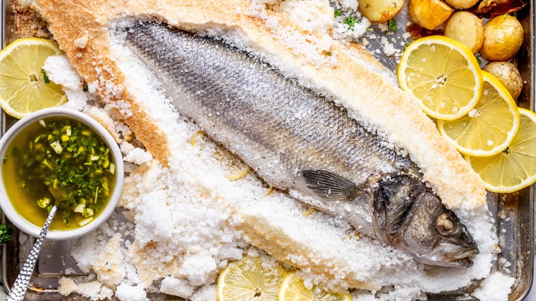 Salt-baked fish on a baking sheet