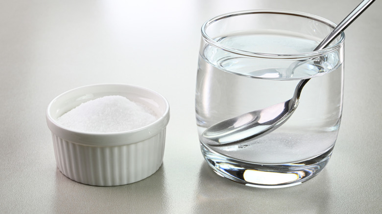 Cup of salt and glass of water