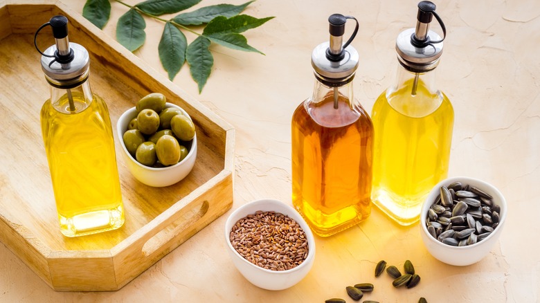 three bottles of cooking oil