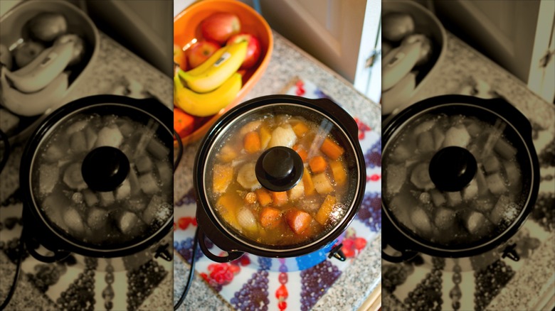 Slow cooker filled with veggies