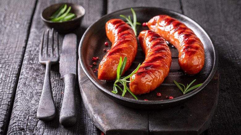 Sausages with grill marks on a plate