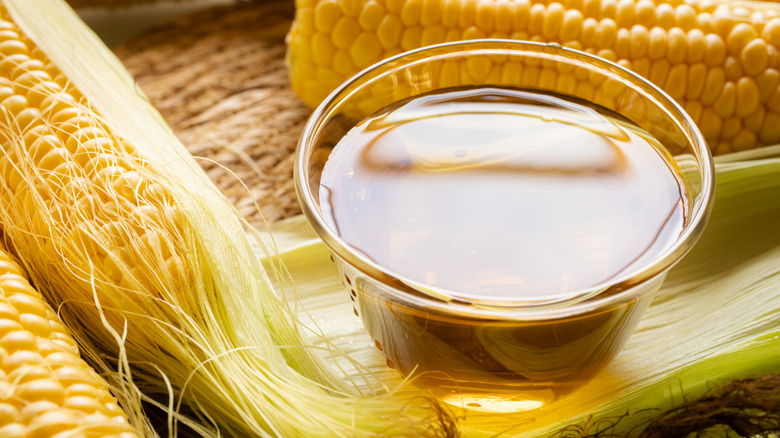 corn silk tea next to two chucks of corn