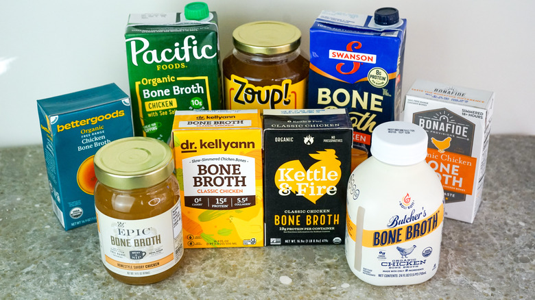 Nine containers of bone broth grouped together